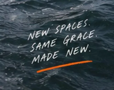 Handwritten text reading New spaces. Same grace. Made new. over dark rippling water