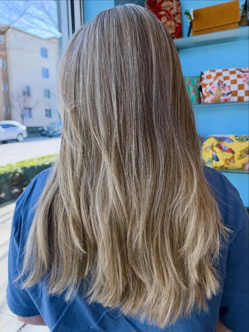 Sun-kissed sandy blonde, styled in soft waves